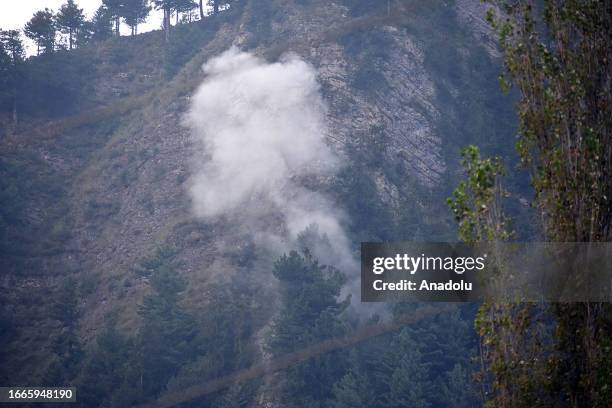 Smoke rises from the mountain after Indian army used ammunitions during the gun-battle between militants and security forces which entered second day...