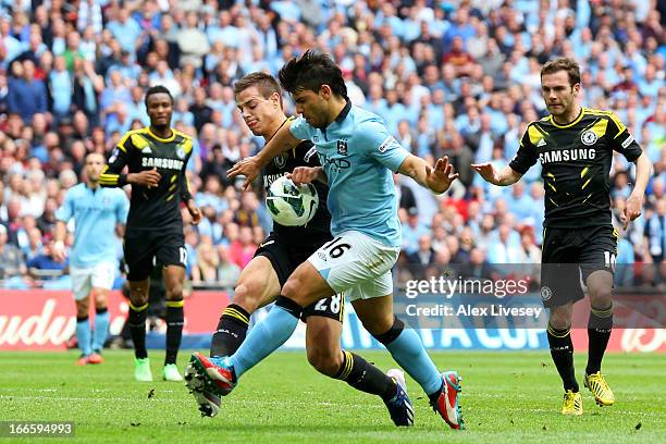 Sergio Aguero of Manchester City tangles with Cesar Azpilicueta of Chelsea during the FA Cup with Budweiser Semi Final match between Chelsea and...