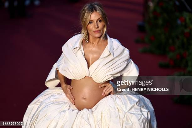 British actress Sienna Miller poses upon arrival to attend the "Vogue World: London" event at the Theatre Royal Drury Lane in central London on the...
