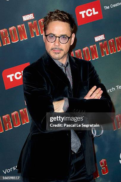 Actor Robert Downey Jr. Poses during the 'Iron Man 3' photocall at Le Grand Rex on April 14, 2013 in Paris, France.