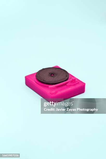 purple record player on green background - spinning toy stock pictures, royalty-free photos & images