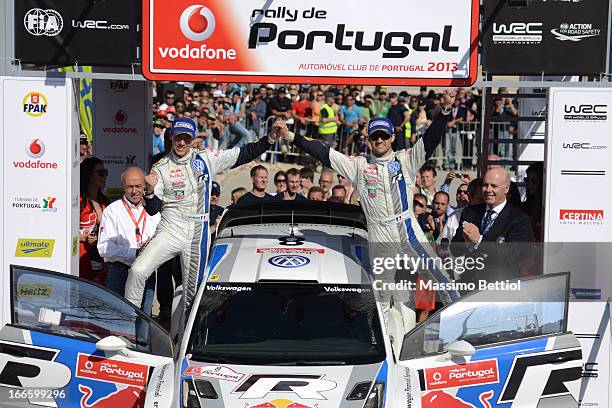 Sebastien Ogier of France and Julien Ingrassia of France celebrate their victory in the final on the podium in front of the Algarve Stadium, during...