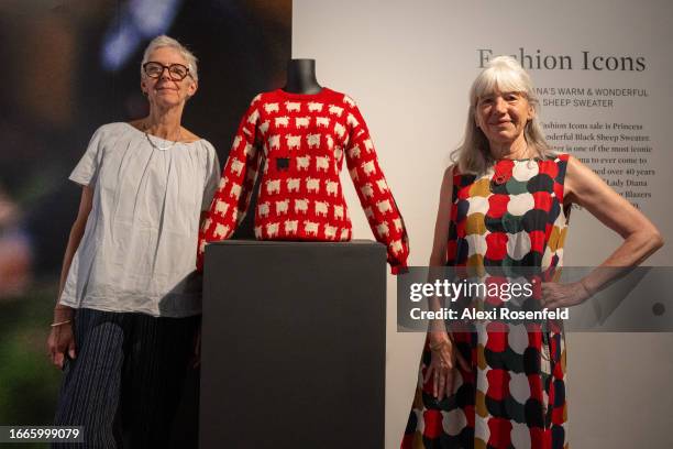 Designers Sally Muir and Joanna Osborne pose with their Black Sheep Sweater worn by Lady Diana Spencer on the first day it is displayed at Sotheby's...