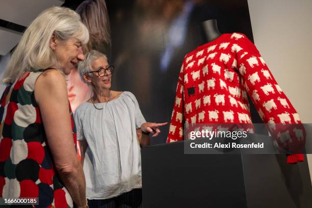 Designers Sally Muir and Joanna Osborne pose with their Black Sheep Sweater worn by Lady Diana Spencer on the first day it is displayed at Sotheby's...