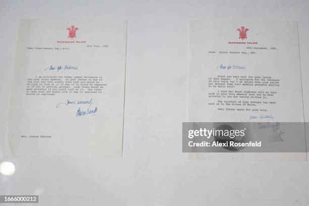 Letters on Buckingham Palace stationary sent from Princess Diana’s private secretary, Oliver Everett CVO, are on display near the black sheep sweater...