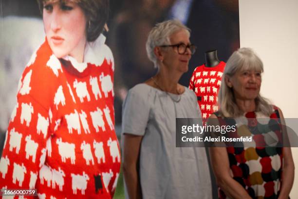 Designers Sally Muir and Joanna Osborne pose with their Black Sheep Sweater worn by Lady Diana Spencer on the first day it is displayed at Sotheby's...