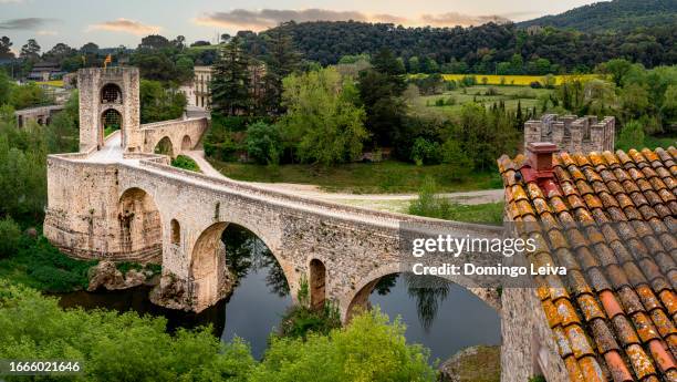 sunset shot besalú roman bridge - besalu stock pictures, royalty-free photos & images