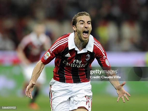 Mathieu Flamini of AC Milan celebrates scoring the first goal during the Serie A match between AC Milan and SSC Napoli at San Siro Stadium on April...