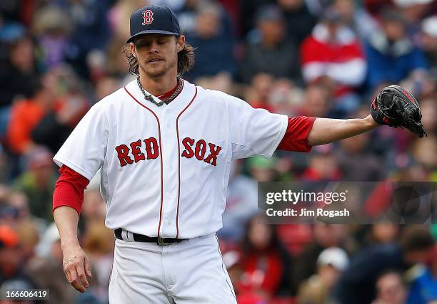 Clay Buchholz of the Boston Red Sox reacts after against the Tampa Bay Rays in the eighth inning after giving a second hit of the game at Fenway Park...