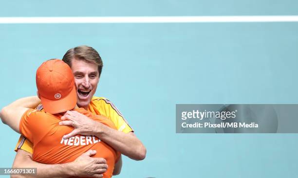 Tallon Griekspoor of Netherlands celebrate a win against Frances Tiafoe of United States with Team Captain of Netherlands Paul Haarhuis during the...