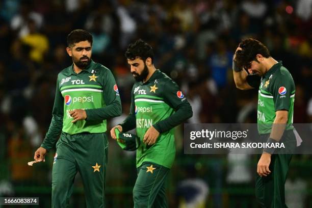 Pakistan's captain Babar Azam and team mates react as they walk back to the pavilion after Sri Lanka's victory by 2 wickets after the Asia Cup 2023...