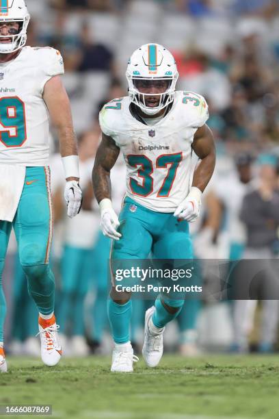 Myles Gaskin of the Miami Dolphins lines up on the line of scrimmage against the Jacksonville Jaguars during the second half at EverBank Stadium on...