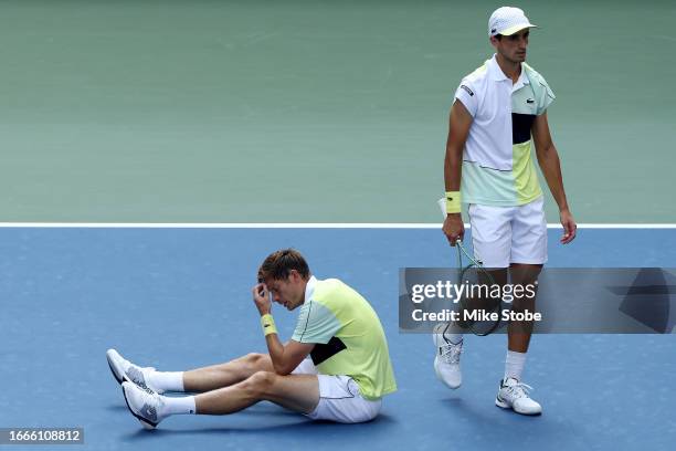 Nicolas Mahut and Pierre-Hugues Herbert of France react against Rohan Bopanna of India and Matthew Ebden of Australia after their Men's Doubles...