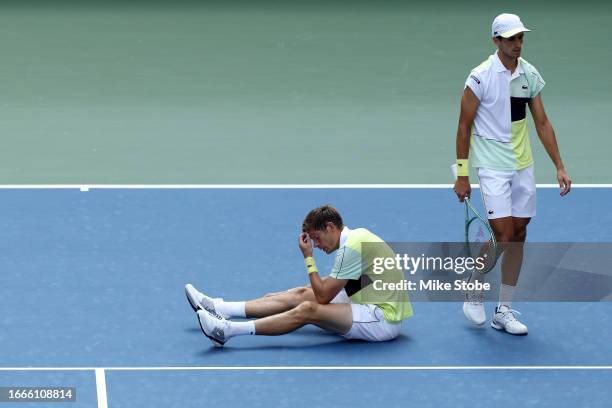 Nicolas Mahut and Pierre-Hugues Herbert of France react against Rohan Bopanna of India and Matthew Ebden of Australia after their Men's Doubles...