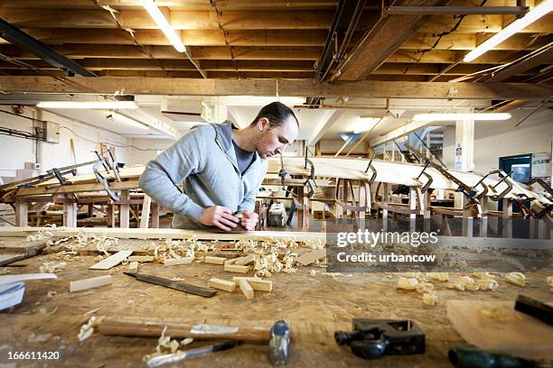 boat carpenter, using a wood plane - shavings stock pictures, royalty-free photos & images