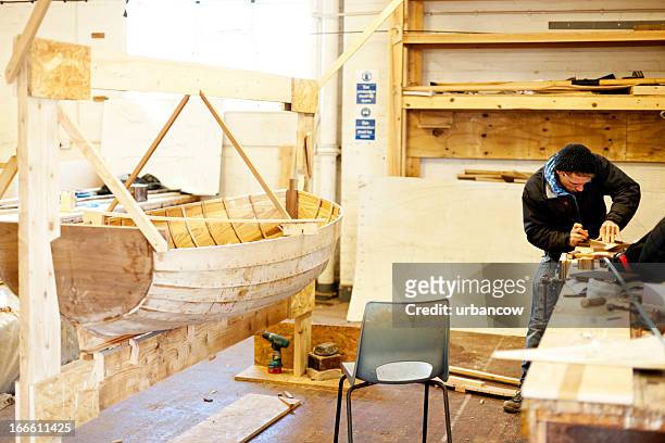 handcrafted wooden rowing boat - båthus bildbanksfoton och bilder