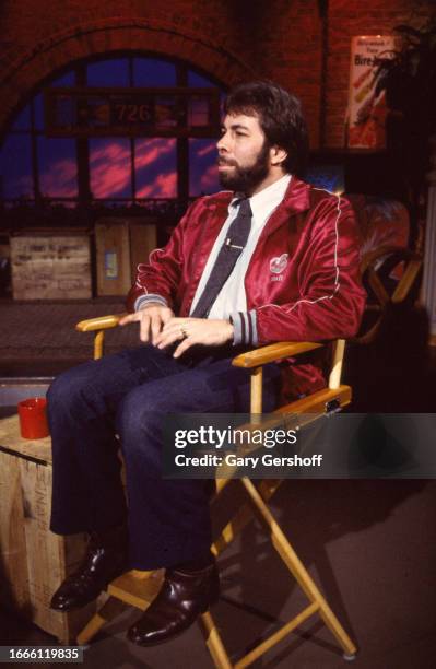 View of American computer engineer and programmer Steve Wozniak, co-founder of Apple Computer, as he sits in a director's chair during an interview...