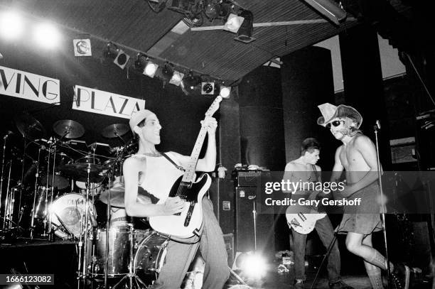 Members of American Rock group Red Hot Chili Peppers perform onstage at Irving Plaza, New York, New York, August 4, 1984. Pictured are, from left,...