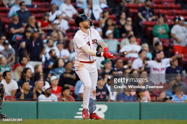 Trevor Story of the Boston Red Sox watches his three-run home run against the New York Yankees during the eighth inning of game one of a doubleheader...