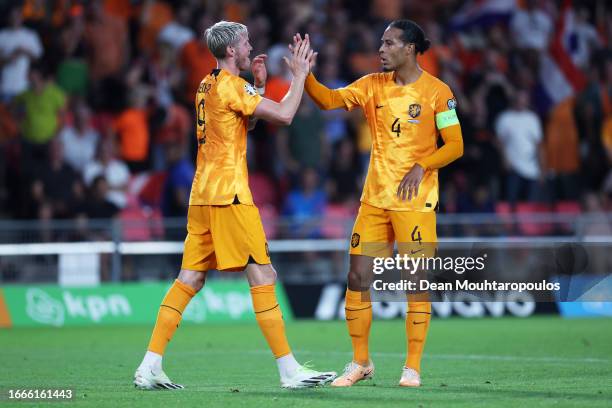 Wout Weghorst of Netherlands celebrates with teammate Virgil van Dijk after scoring the team's third goal during the UEFA EURO 2024 European...