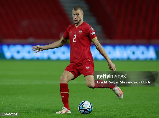 Strahinja Pavlovic of Serbia runs with the ball during the UEFA EURO 2024 European qualifier match between Serbia and Hungary at Stadion Rajko Mitić...