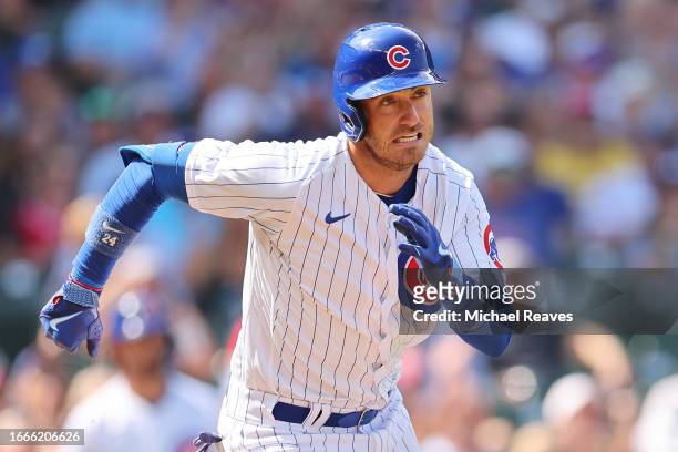Cody Bellinger of the Chicago Cubs runs to second base after hitting a double against the San Francisco Giants during the third inning at Wrigley...