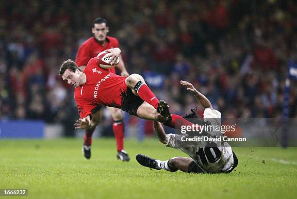 Mark Jones of Wales is brought down by Nicky Little of Fiji during the International Friendly match held on November 9, 2002 at the Millennium...