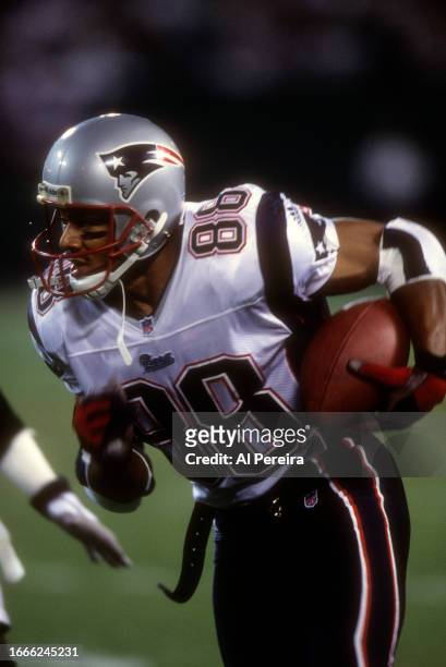 Wide Receiver Terry Glenn of the New England Patriots has a long gain in the game between the New England Patriots vs the New York Jets at The...
