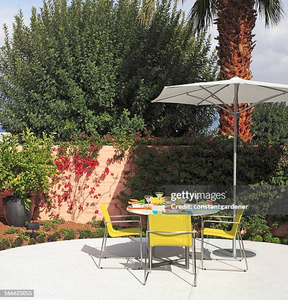 summer patio dining - patio umbrella stock pictures, royalty-free photos & images