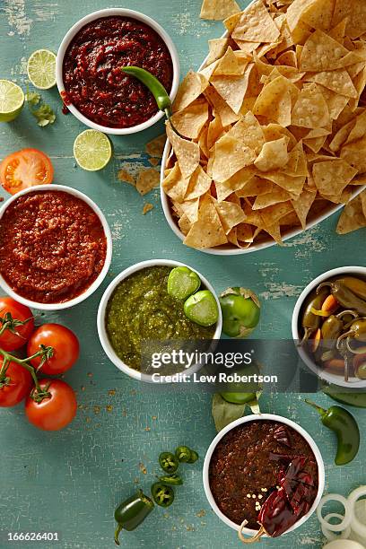 salsas and chips - salsa sauce stock pictures, royalty-free photos & images