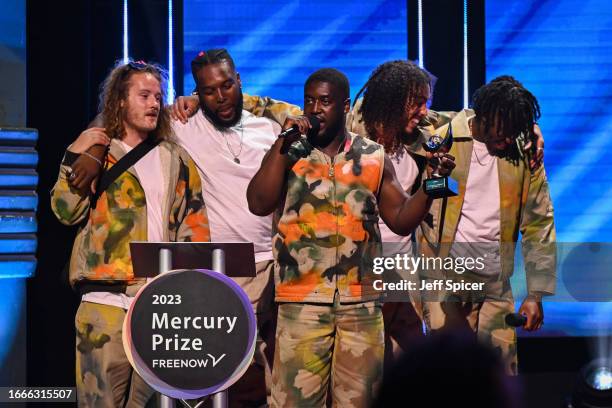 Members of Ezra Collective, Joe Armon-Jones, TJ Koleoso, Femi Koleoso, James Mollison and Ife Ogunjobi on stage after winning The Mercury Prize...