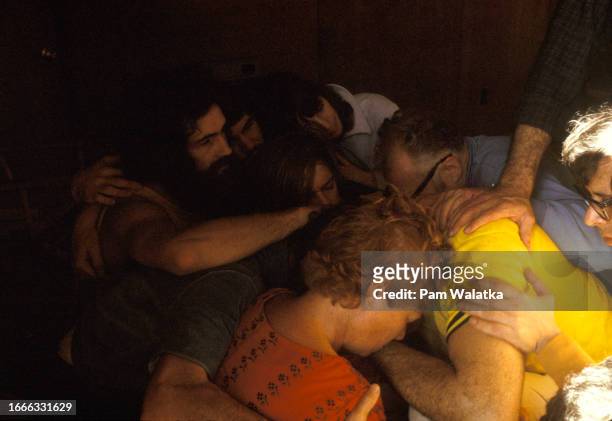 View of participants in a group hug during an Bioenergetics workshop at the Esalen Institute, Big Sur, California, 1968. Among those pictured are...