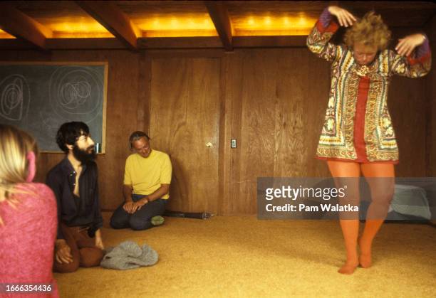 View of philanthropist Helen Laney Stephens as she dances before fellow participants in support group at the Esalen Institute, Big Sur, California,...