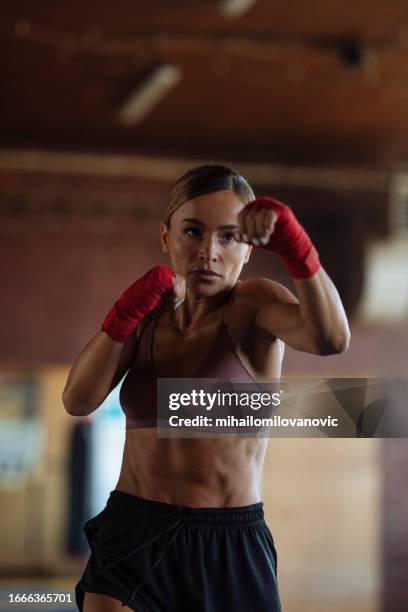 working on her boxing skills - shadow boxing stock pictures, royalty-free photos & images