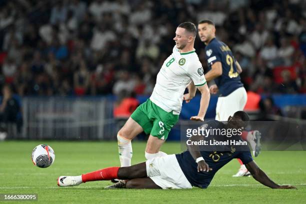 Marcus Thuram of France tackles Alan Browne of the Republic of Ireland during the UEFA EURO 2024 European qualifier match between France and Republic...