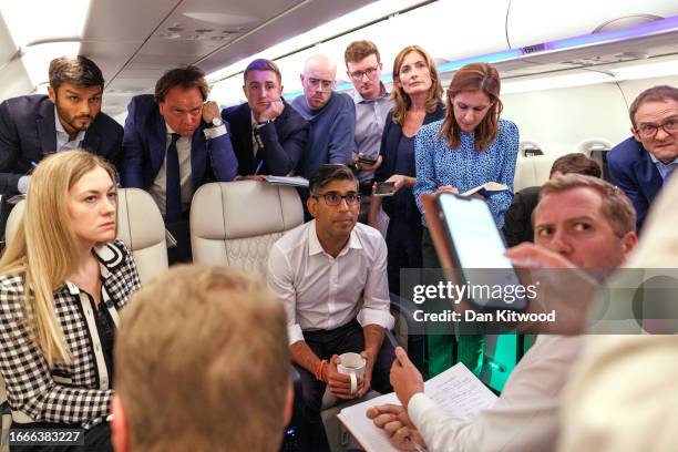 British Prime Minister Rishi Sunak speaks with journalists onboard the Voyager aircraft as he travels to India for the G20 Summit on September 07,...
