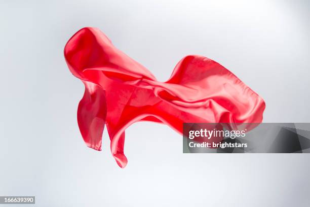 floating red silk on a bright background - red silk stock pictures, royalty-free photos & images