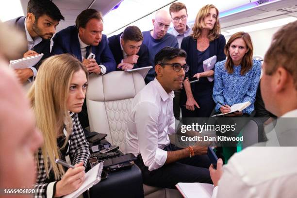 British Prime Minister Rishi Sunak speaks with journalists onboard the Voyager aircraft as he travels to India for the G20 Summit on September 07,...