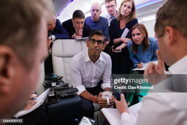 British Prime Minister Rishi Sunak speaks with journalists onboard the Voyager aircraft as he travels to India for the G20 Summit on September 07,...