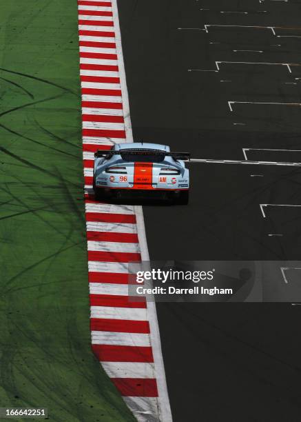 Jamie Campbell-Walker of Great Britain drives the Gulf AMR Aston Martin VantageV8 ahead of the driven by Bruno Senna of Brazil during the FIA World...