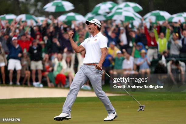 Adam Scott of Australia celebrates after making a birdie on the 18th hole during the final round of the 2013 Masters Tournament at Augusta National...