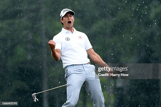 Adam Scott of Australia celebrates after making a birdie on the 18th hole during the final round of the 2013 Masters Tournament at Augusta National...