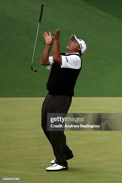 Angel Cabrera of Argentina reacts after missing a birdie putt on the second sudden death playoff hole before losing to Adam Scott of Australia in...