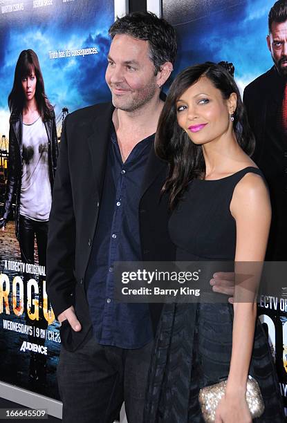 Actress Thandie Newton and husband/writer Ol Parker attend the premiere of 'Rogue' at ArcLight Hollywood on March 26, 2013 in Hollywood, California.