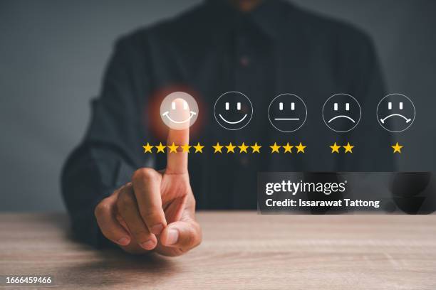 customer service and satisfaction concept ,business people are touching the virtual screen on the happy smiley face icon to give satisfaction in service. rating very impressed - smiley face stock pictures, royalty-free photos & images