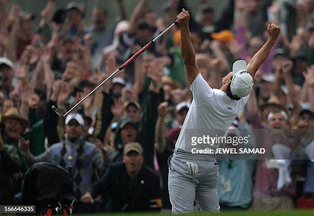 Adam Scott of Australia celebrates his win on the 10th hole during a playoff with Angel Cabrera of Argentina at the fourth round of the 77th Masters...