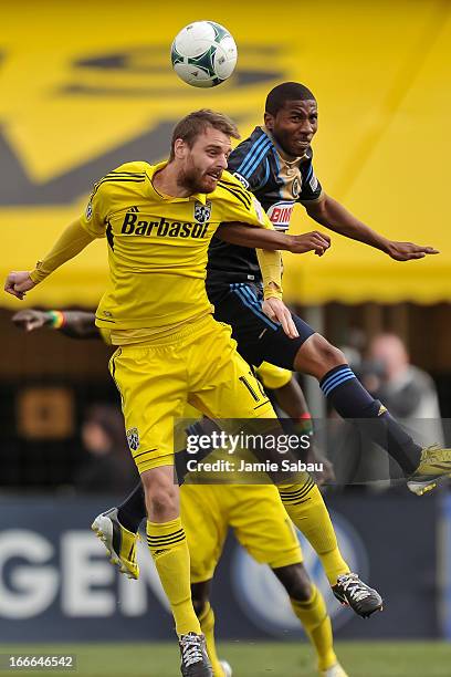 Eddie Gaven of the Columbus Crew and Raymon Gaddis of Philadelphia Union battle for control of the ball on April 6, 2013 at Crew Stadium in Columbus,...