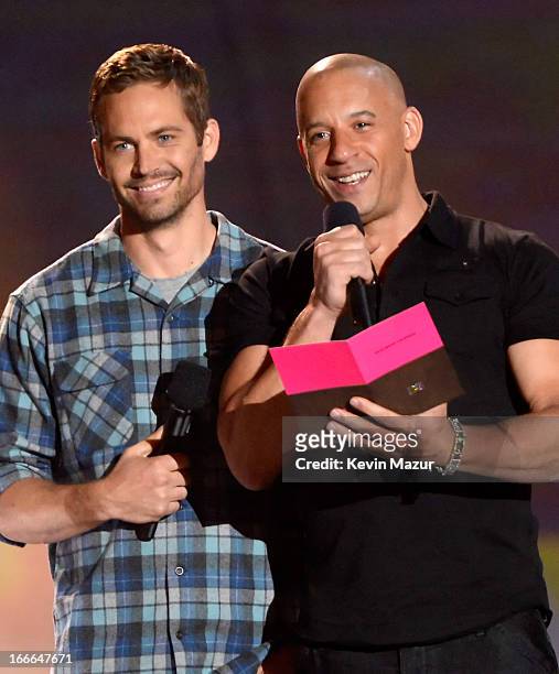 Actors Paul Walker and Vin Diesel speak onstage during the 2013 MTV Movie Awards at Sony Pictures Studios on April 14, 2013 in Culver City,...