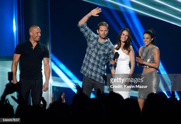 Actor Vin Diesel, actor Paul Walker, actress Jordana Brewster and actress Michelle Rodriguez speak onstage during the 2013 MTV Movie Awards at Sony...