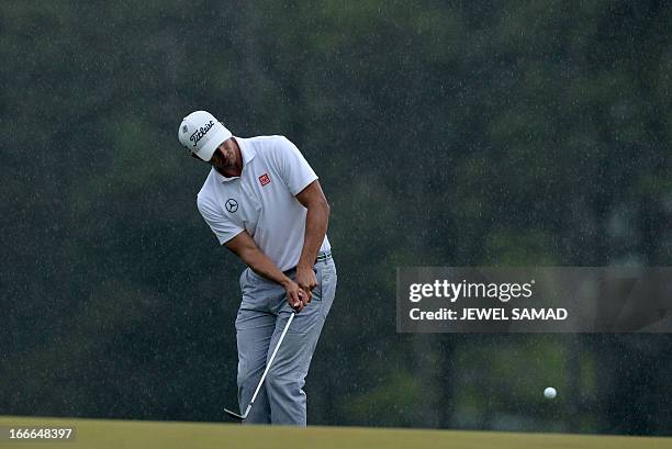 Adam Scott of Australia plays during the fourth round at the 77th Masters golf tournament at Augusta National Golf Club on April 14, 2013 in Augusta,...